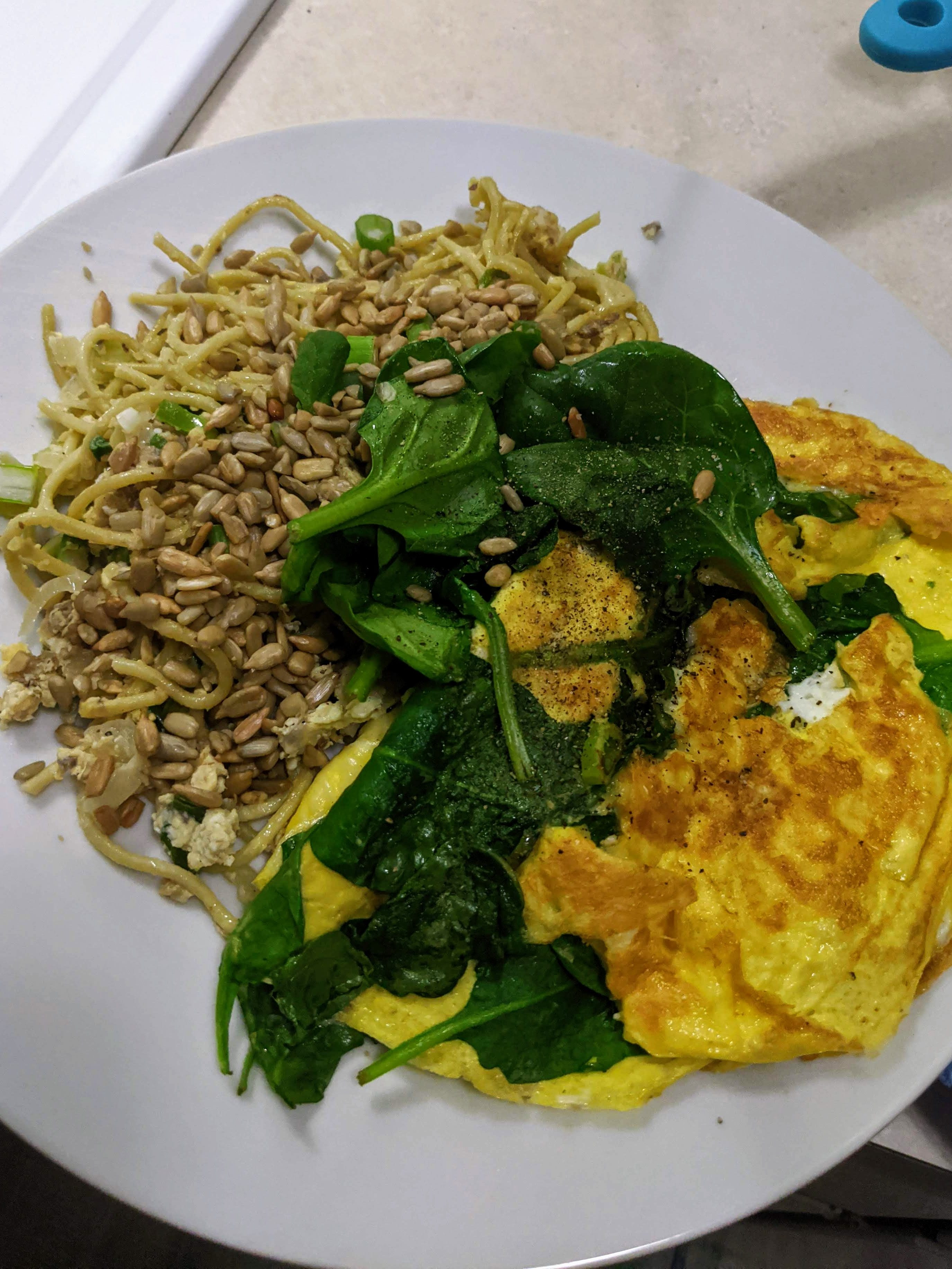 Veggie pasta with seeds plus spinach and cheese omelet